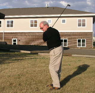 Jim May, SMHC Foundation Development Director, practices his golf swing.