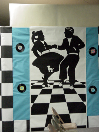 Some of the decorations for the Fashion Show using an At the Hop theme.