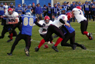 It's a fumble!! Danny Riener, center, tries to beat a Genesee player to the ball.