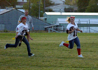 Meghan VanderPas carries the ball for the Jr.-Soph. team while Casandra Schaeffer trails on the play.