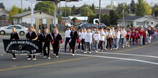 The Band and cheerleaders along with many Elementary students lead the parade.