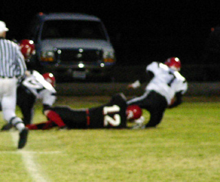 Corey Schaeffer sacks the Deary quarterback for a big loss.