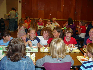 New Middle School student body president David Sigler, center with curly hair, sings to help raise money for Katrina victims.