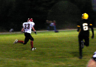 Tim Russell gains big yardage on a pass play.