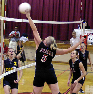 Sarah Forsmann tips the ball over for a point.