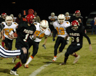 Mat Forsmann, 1, gained big yardage on this run, setting up Prairie's second touchdown. At right is Phil Henry.
