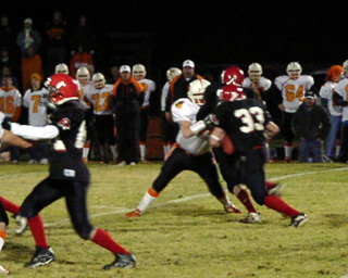 Tim Russell cuts up into a hole created by Prairie blockers.