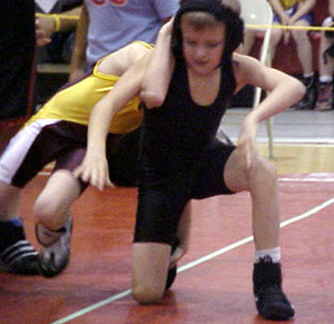 Dally Ratcliff tries to stand up and break his opponent's hold.