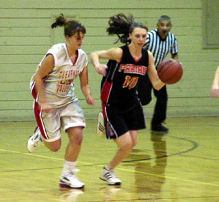 Tiffany Schaeffer brings the ball upcourt after a turnover.
