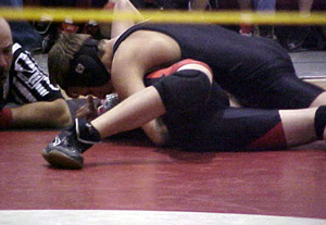 Tyrell Langston is about to pin his opponent as he earns a gold medal.