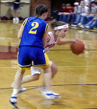 Ashley Jackson drives past a Nezperce defender.