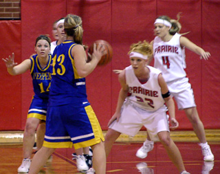 Natalie Arnzen defends the ball with Bridget Enneking behind her.