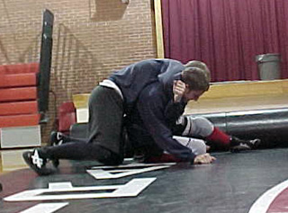 Wrestlers go at it in preparation for their first action this Saturday.