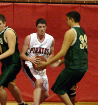 Corey Schaeffer looks for an outlet pass after pulling down a rebound.