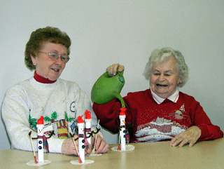 Irene Terhaar (left) and Margaret Stewart have a good time serving as volunteers at St. Mary's Hospital.