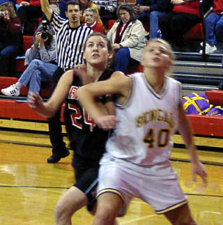 Becky Gehring focuses on a rebound in the game against Lewiston JV.