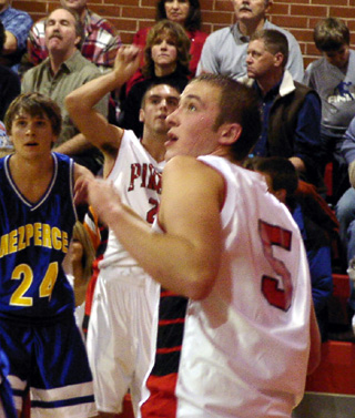 Mat Forsmann and Seth Crane watch to see if Mat's shot goes in.