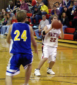 Sean Daly sets up for a 3-point attempt against Nezperce.