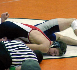 Jake Wimer is about to pin his opponent. He placed 5th in his class.