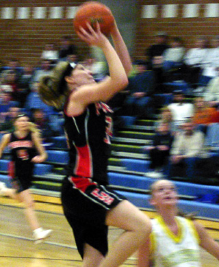 Brittny Behler shoots at Genesee. She was the only player able to muster any offense in the game.