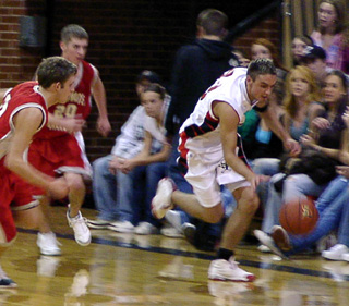 Mat Forsmann heads downcourt after stealing the ball against C.V.