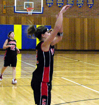 Nicole Nida puts up a shot from the outside against Genesee.