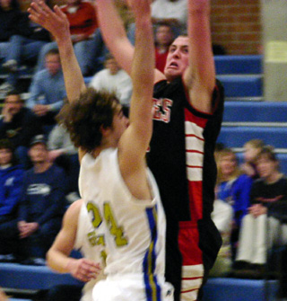 Seth Crane scores on a lay-up at Genesee.