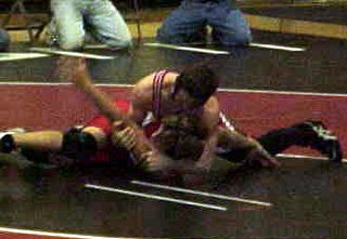 James Jackson wrestles for 1st place.