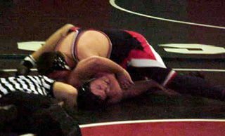 Chance Ratcliff is about to pin his opponent.