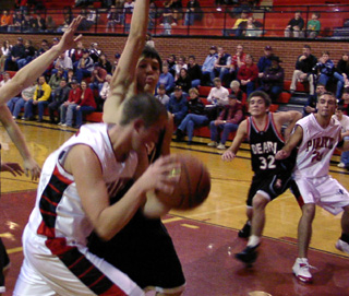 Seth Crane gets past a defender as he goes for a lay-up. At right is Mat Forsmann.