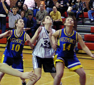 Alexa Prigge fights for rebounding position on a missed free throw.