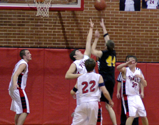 JD Riener attempts to block a shot on defense.