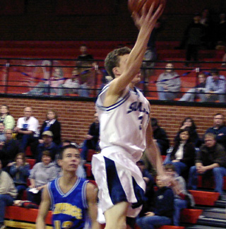 David Spencer soars toward the hoop for a lay-up.