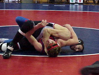 Tony Duman is about to pin this opponent.