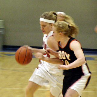 Brittny Behler drives past a Troy defender.