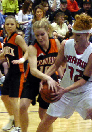 Natalie Arnzen battles Kendrick's Jamie Scott for the ball.