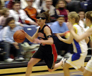 Tiffany Schaeffer drives downcourt against Genesee.