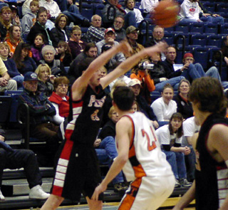 Corey Schaeffer makes a pass against Troy.