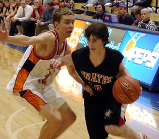 Josh Gabica drives past a Troy defender.