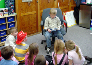 Jacob Stubbers reads Dick & Jane to his Kindergarten classmates.