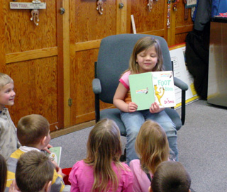 Trista Latimer reads The Foot Book to the Kindergartners.
