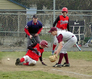 Mat Forsmann slides in safe for the game's first run.