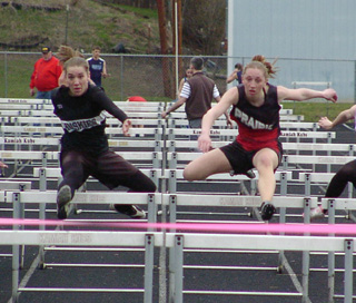 Tabitha Sonnen and Highland's Spencer Thomason had a close race in the 100 hurdles.