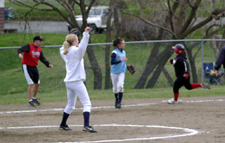 Meghan VanderPas rounds third with encouragement from coach Travis Mader on her homer against Grangeville.