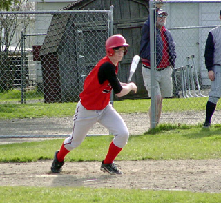 Sam Forsmann connects and head for first against Lewis County.