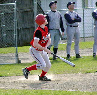 Sean Daly watches the flight of the ball off his bat. He had a double and triple against Lewis County.