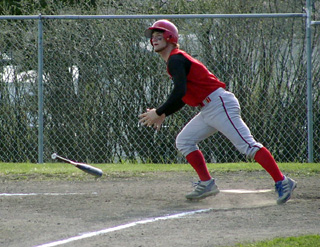 Dan Riener flips the bat as he watches his homer head for the fence in the first Troy game.