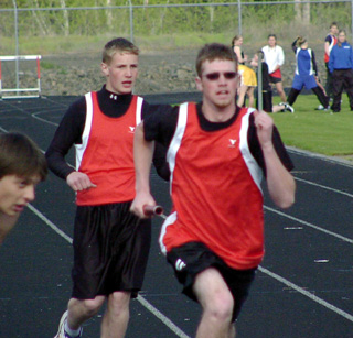 Jack George has just handed off to Daniel Sigler in the 4x200 relay at the White Pine Meet.