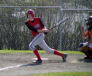 C.J. Rieman watches the flight of a double against Troy.
