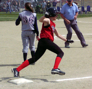 Alli Holthaus rounds third on a homer against Lewis County.
